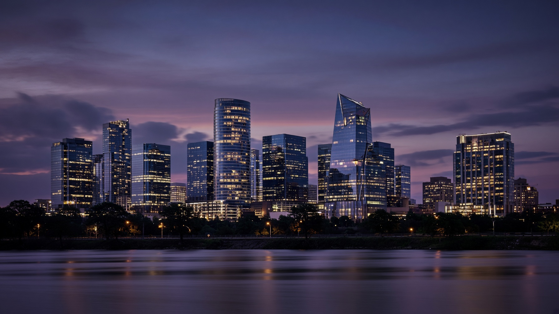 Dusk skyline across a Texas river, glass towers and warm city lights